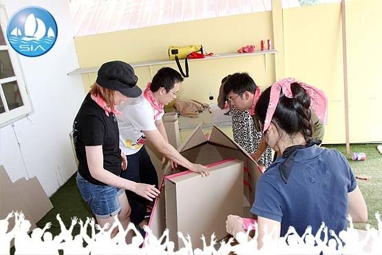 the cardboard boat building challenge begins with a large cardboard box and some tape in sail in asias headquarters