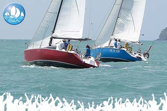 corporate sailing regatta with two sail in asia yachts racing across ao yon bay phuket